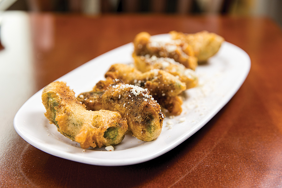The beer battered Fried Avocados are topped with queso fresco and ranch seasoning.
