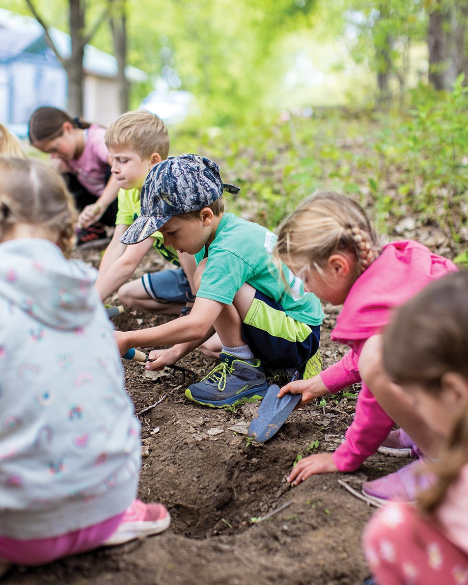 Children at Our Village School in Lakeville learn a variety of skills outdoors in multi-age cohorts.