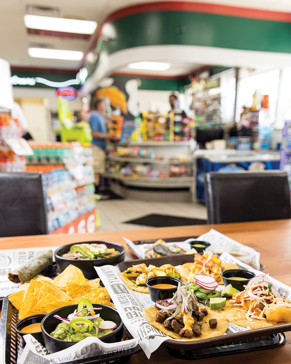 Diners can get their food to-go or eat at one of the tables set up in the gas station.