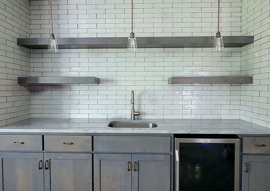 Commit to a backsplash by tiling up to the ceiling or upper cabinets.
