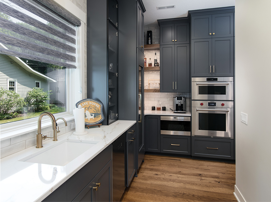 The scullery contains appliances, a wine fridge and an extra sink.