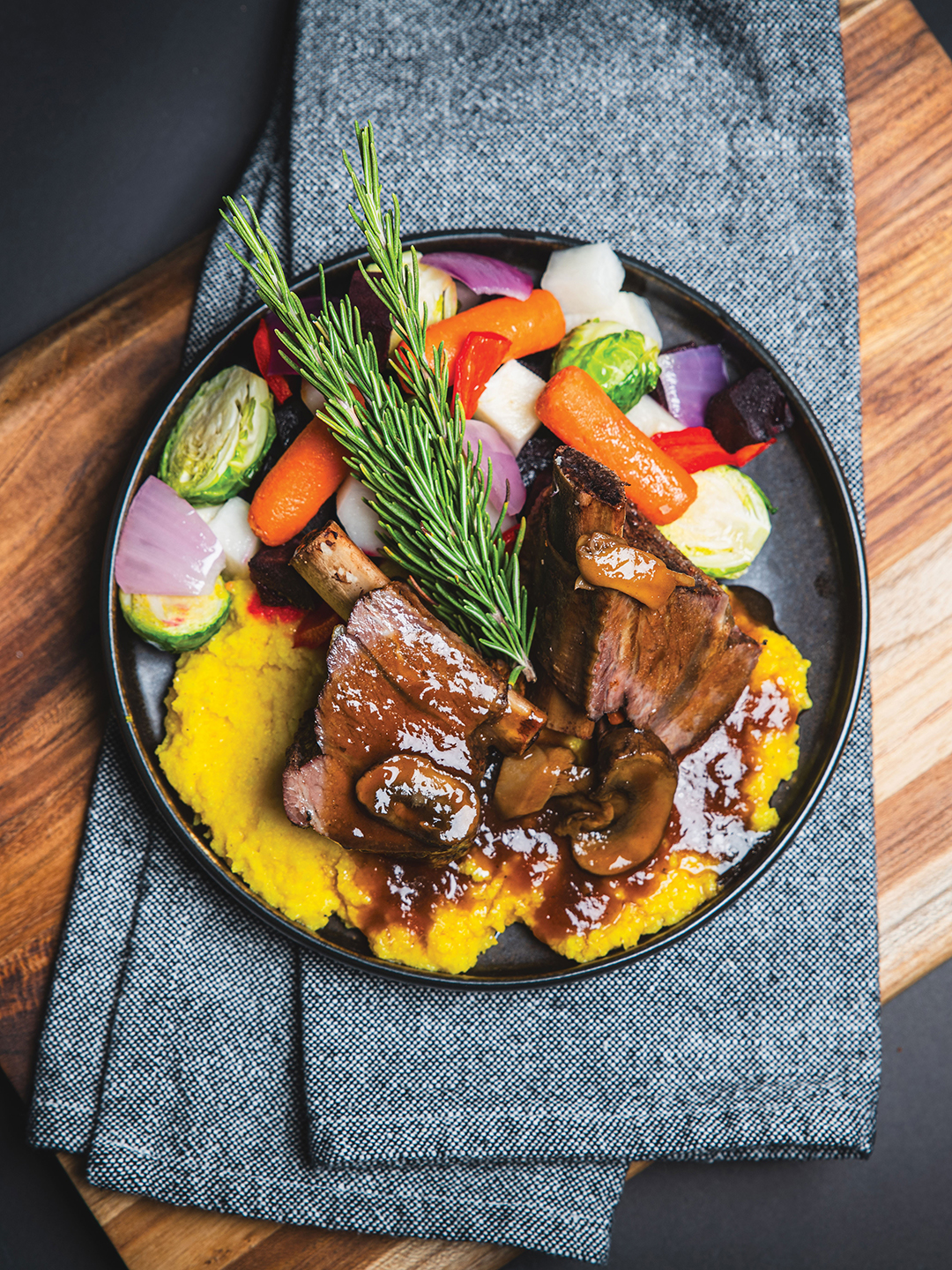 Braised bison short ribs with mushroom demi-glace, roasted vegetables and sweet corn and hominy mash from the Native to Minnesota menu.
