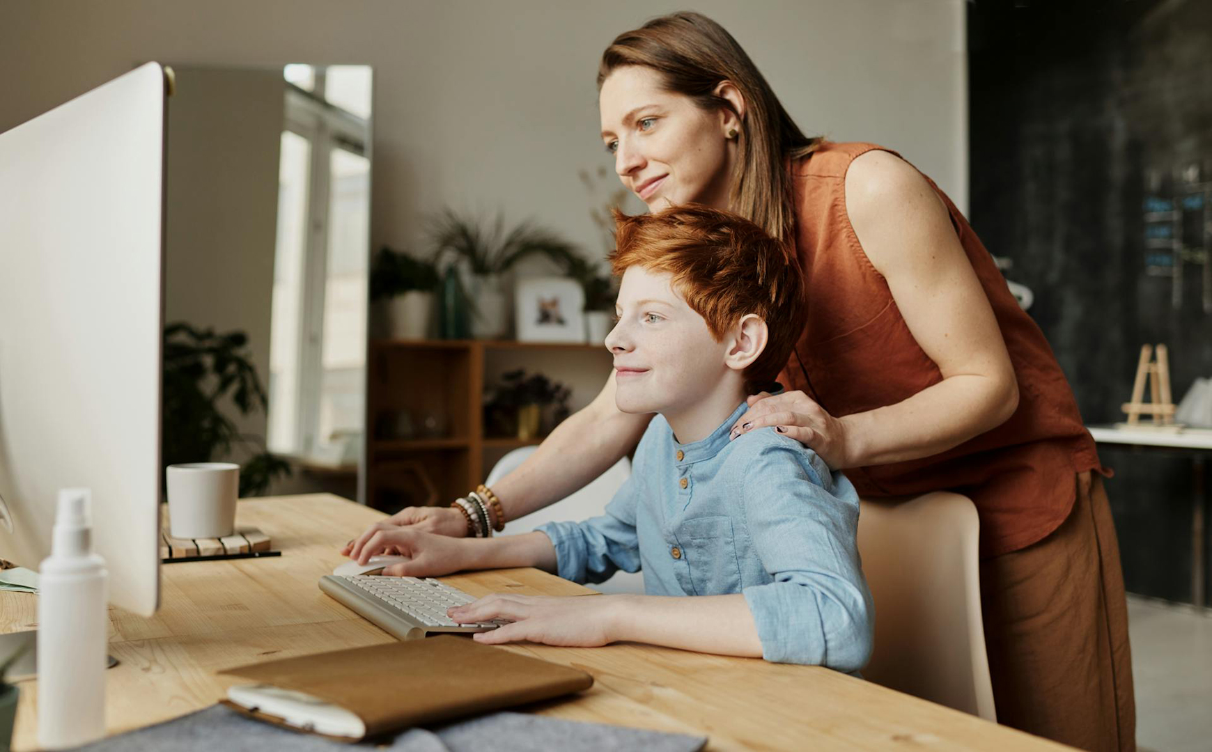Mother and son looking at a computer