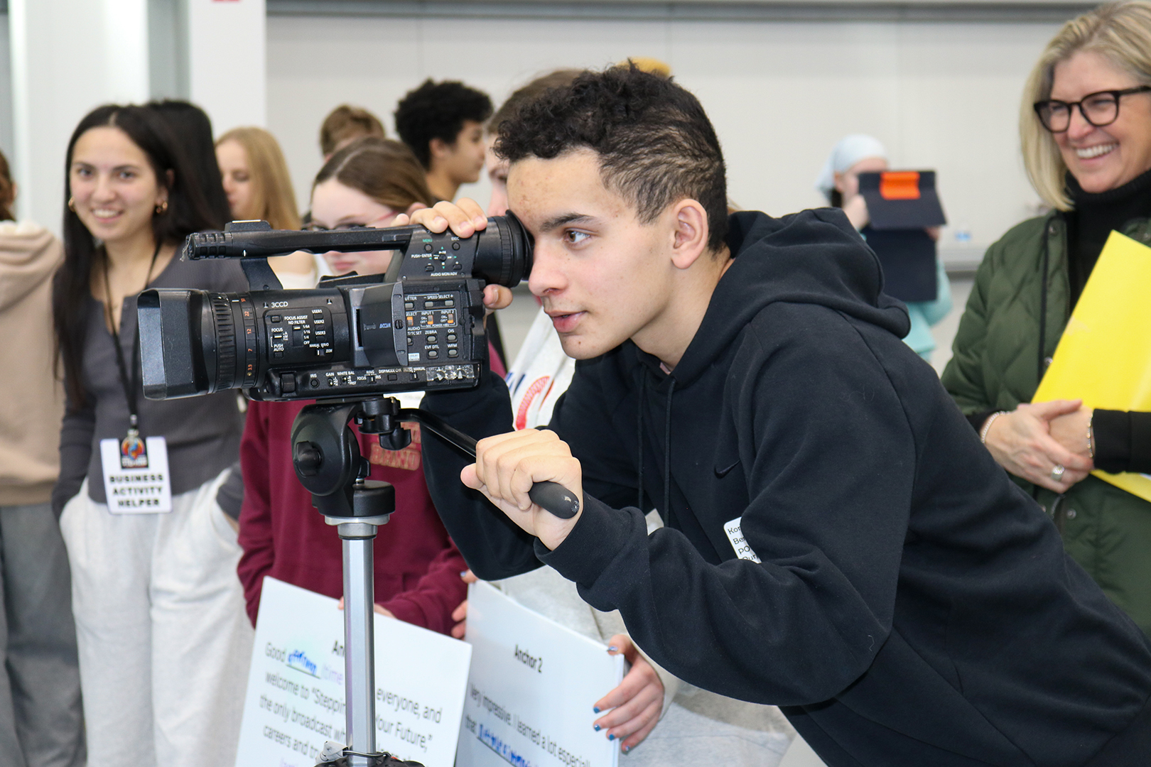 Eighth graders are given the opportunity to learn how to produce a newscast.