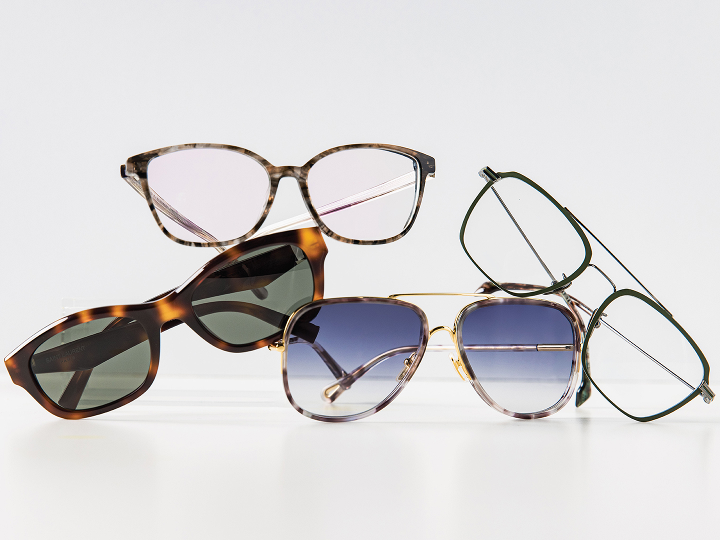 From left to right: Saint Laurent SL M172 ($474) sunglasses embrace ’90s style; Find a modern take on the classic tortoise shell with NW77th Mod 1074 ($240); The Chloe CH0382S ($456) incorporates two trends—aviators and the double bar—in one pair of sunglasses; STATE Optical Co.’s Waveland ($348) uses titanium material to create a very lightweight aviator with a double bar.