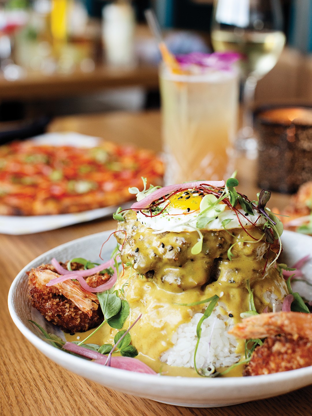 The Loco Moco is made with a Wagyu beef patty from Angie’s Acres in Aitkin, coconut shrimp, sushi rice and golden curry.